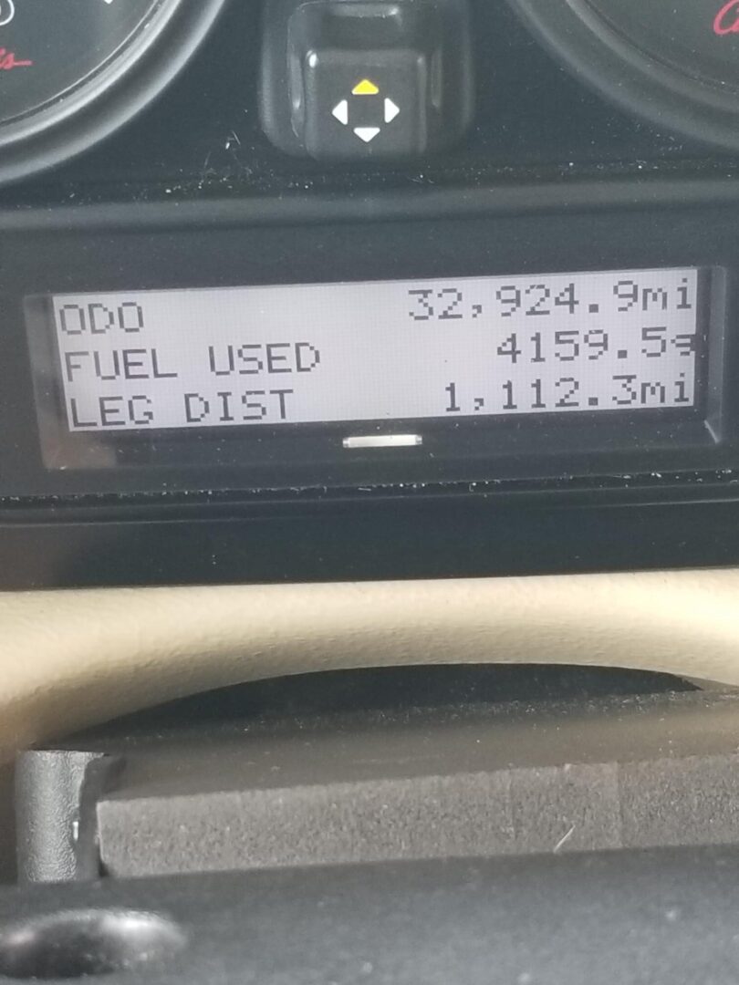 The dashboard of a car with a fuel gauge.