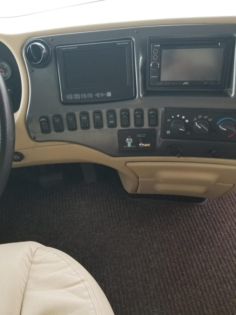 The dashboard and steering wheel of an rv.