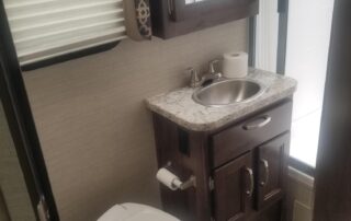 A small bathroom with a toilet and sink.