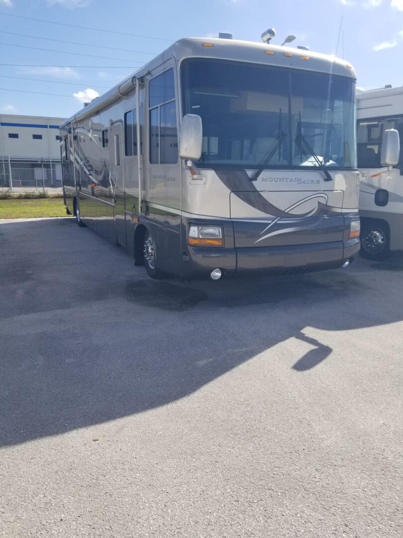 A large rv parked in a parking lot.