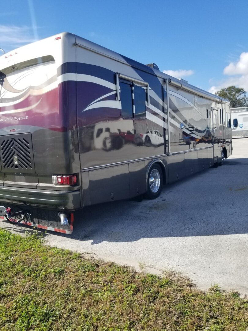 An rv parked in a parking lot.