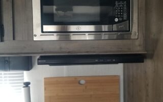 A microwave oven in a small kitchen.