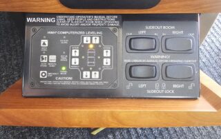 RV slideout controls and warning signs.