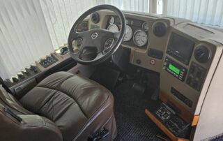 RV driver's seat with leather and controls.