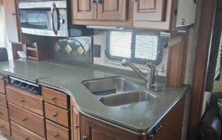 Kitchen with cabinets and a double sink.