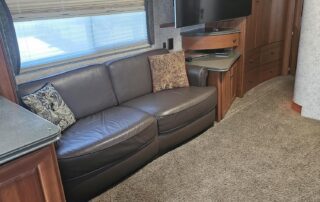 Living room interior with couch and TV.