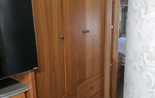 Wooden cabinets with drawers in an RV.