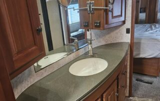 Bathroom vanity with sink and drawers in RV.