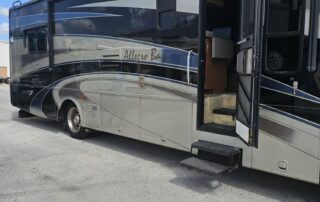 Allegro Bay motorhome parked on asphalt.