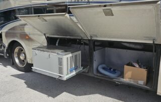 RV storage compartments with air conditioner.