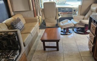 RV living room with couches and table.