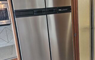 Stainless steel refrigerator in a kitchen.